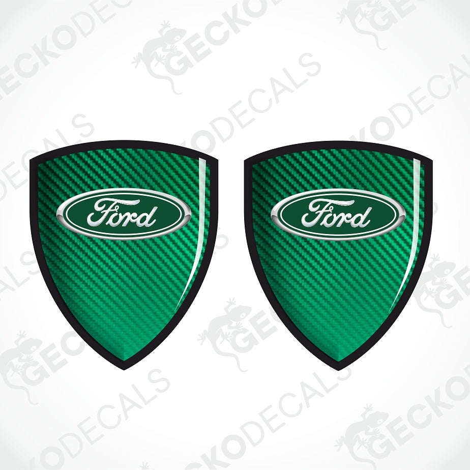 Two green shield-shaped decals with a carbon fiber texture and the Ford logo in the center, shown on a white background with diagonal watermarks.