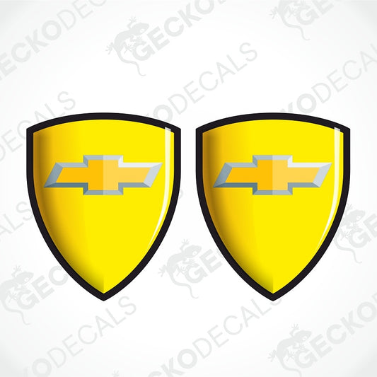 Two yellow shield-shaped decal designs with black borders and a Chevrolet bowtie logo in the center, shown on a white background with diagonal watermark text.