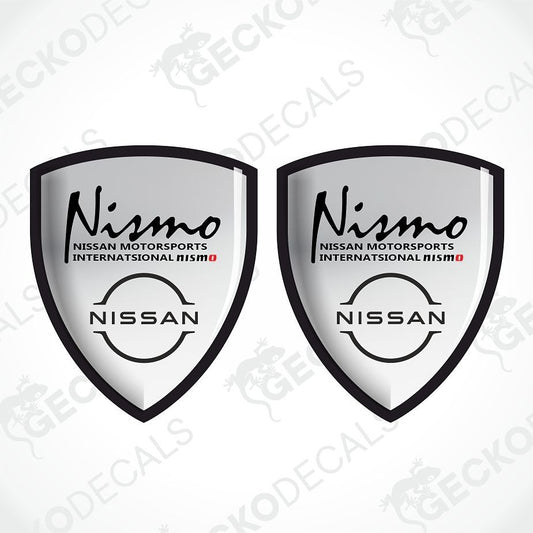 Two identical shield-shaped Nissan Nismo decals on a white background with diagonal watermark text.
