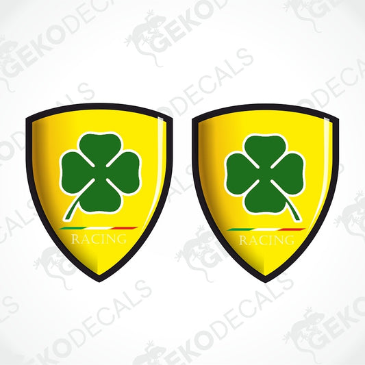 Two identical yellow Ferrari-style shield decals with a green four-leaf clover and the words 'GEKODE RACING' on a white background with faint watermarks.