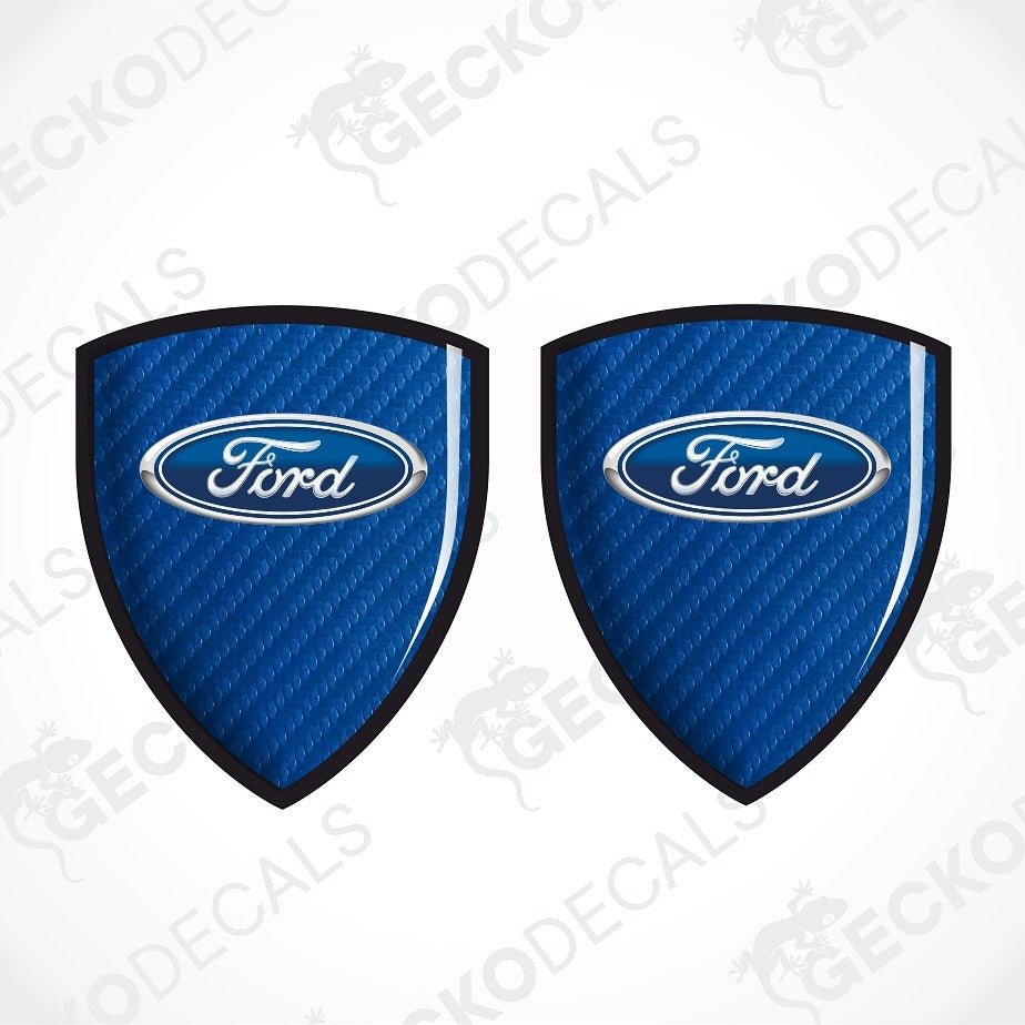 Two blue Ford shield-shaped decal stickers with a carbon fiber texture and the classic Ford oval logo in the center, displayed on a white background with diagonal watermarks.