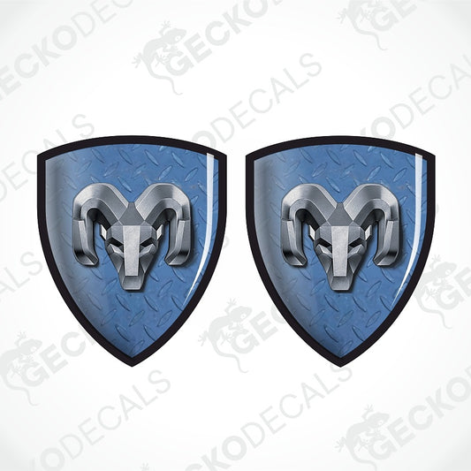 Two identical blue shield-shaped decals with a black border and a silver ram head logo, shown on a white background with diagonal watermark text.
