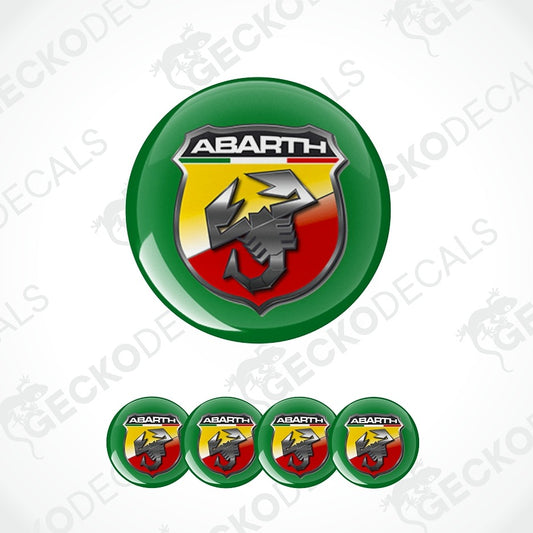 A set of Abarth badge emblems, featuring one large glossy green button with the Abarth Scuderia Ferrari logo and four smaller matching buttons aligned below on a white background with faint watermarks.