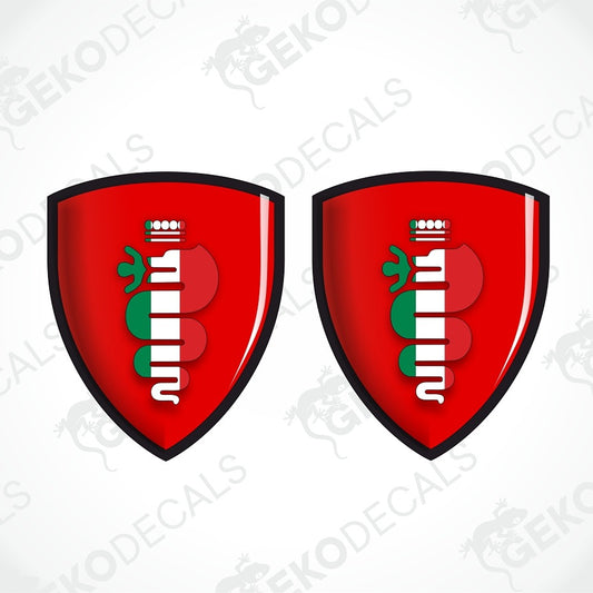 Two identical red shield-shaped decals with a black outline, featuring a vertical white and green striped emblem resembling a stylized flag or logo, shown on a light gray background with faint watermark text.