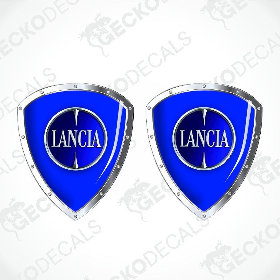 Two identical blue and silver Lancia shield-shaped decals on a light gray background with diagonal watermark text.