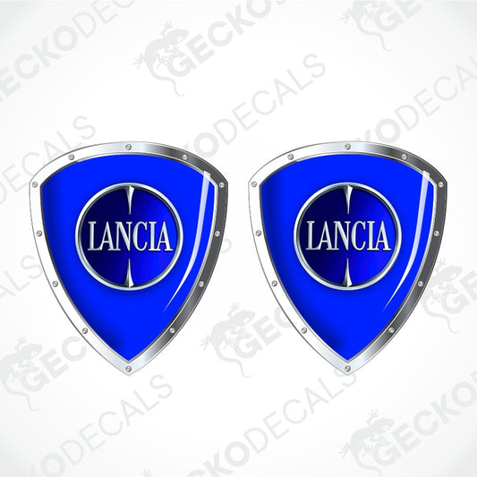 Two identical blue and silver Lancia shield-shaped decals on a light gray background with diagonal watermark text.