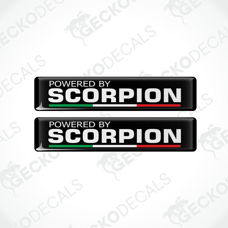Two identical black rectangular decal stickers with the text 'POWERED BY SCORPION' in white, featuring a green and red stripe under 'SCORPION' on a light gray background with faint Geckodec watermarks.