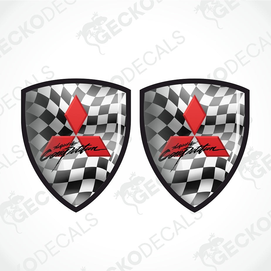 Two identical shield-shaped decals featuring a black and white checkered flag pattern, a red diamond, and the words 'Absolute Competition' in black script, shown on a light gray background with faint watermark text.