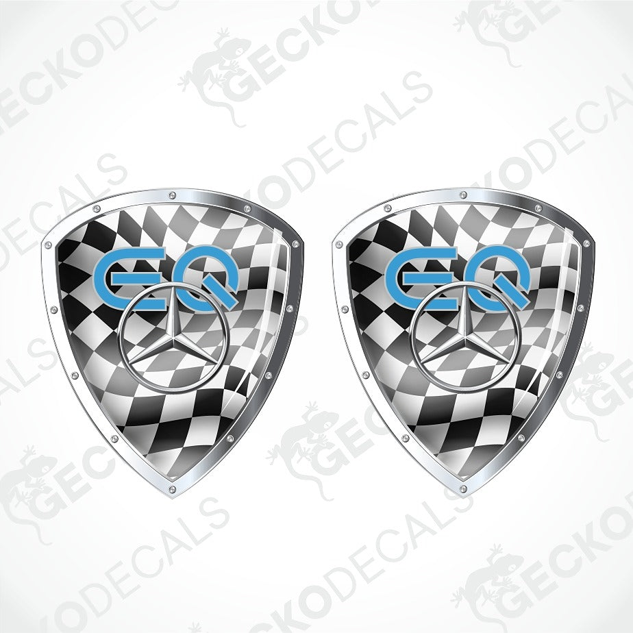 Two identical shield-shaped car decals with a black and white checkered pattern, a silver Mercedes-Benz star logo, and blue 'EQ' lettering, shown on a light gray background with diagonal watermarks.