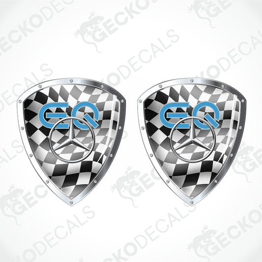 Two identical shield-shaped car decals with a black and white checkered pattern, a silver Mercedes-Benz star logo, and blue 'EQ' lettering, shown on a light gray background with diagonal watermarks.