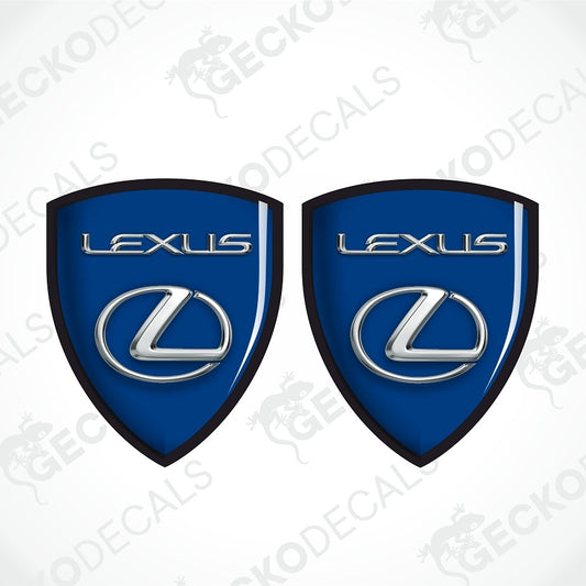 Two blue Lexus shield-shaped decals with black borders, silver Lexus lettering, and the Lexus logo, shown on a white background with faint GECKODECALS watermarks.