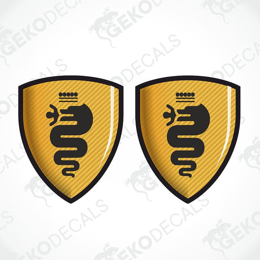 Two identical yellow shield-shaped decals with a black border and a black snake emblem, shown side by side on a white background with diagonal watermark text.