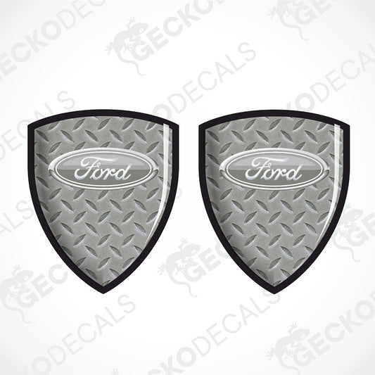 Two Ford shield-shaped metal diamond plate decals on a white background with a faint watermark pattern.