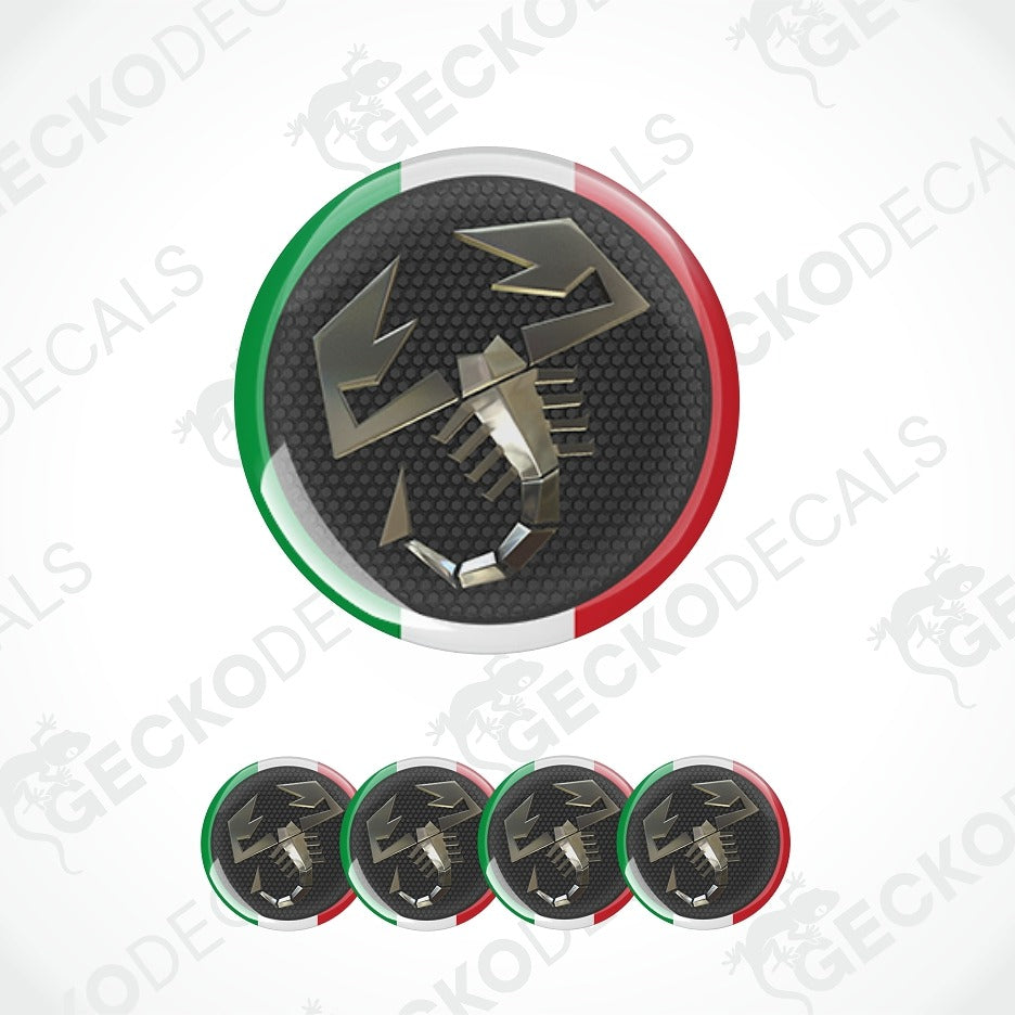 A circular decal or sticker design featuring a metallic scorpion emblem over a black textured background, bordered by green, white, and red curved sections resembling the Italian flag. Smaller versions of the same design appear along the bottom on a light gray background with repeated watermark text.