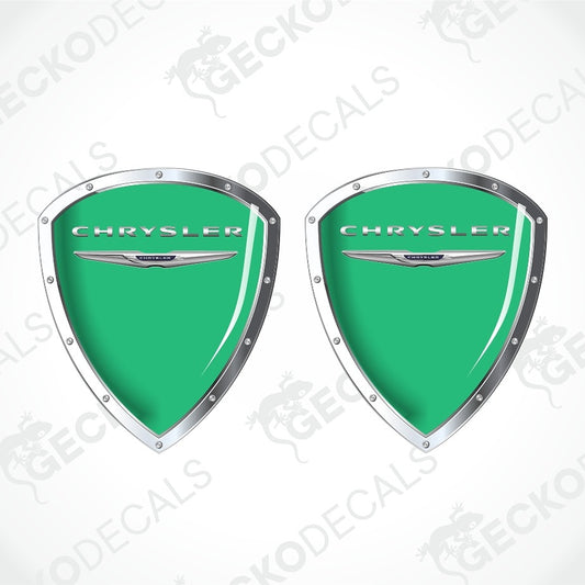 Two green Chrysler shield-shaped decals with silver borders and the Chrysler logo, shown on a white background with diagonal watermark text.