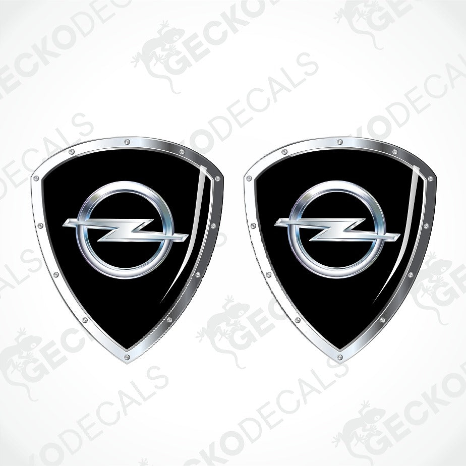 Two identical black and silver Opel shield-shaped decals on a light gray background with faint GECKODECALS watermarks.