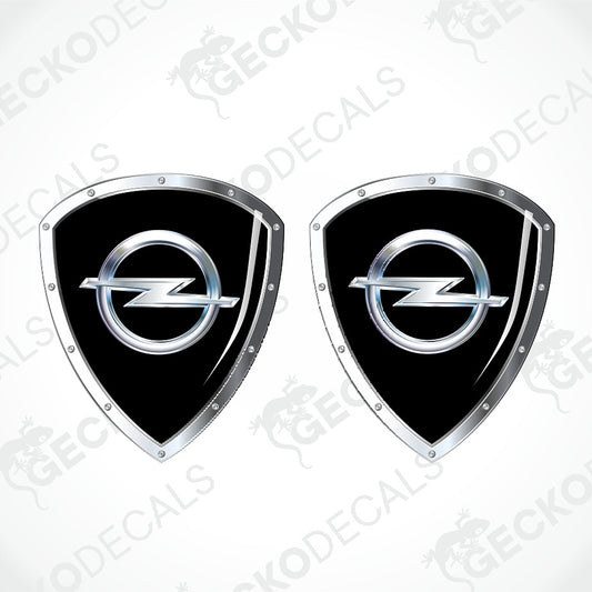 Two identical black and silver Opel shield-shaped decals on a light gray background with faint GECKODECALS watermarks.