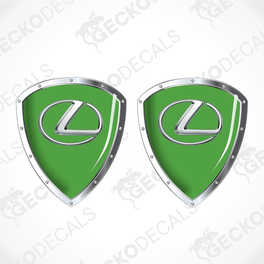 Two green Lexus shield-shaped decals with silver metallic borders and the Lexus logo in the center, shown on a white background with faint watermark text.