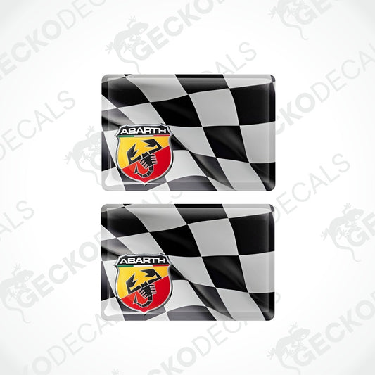 Two rectangular glossy decals with a black and white checkered flag design and the Abarth logo, shown on a light gray background with repeated GECKODEC watermarks.