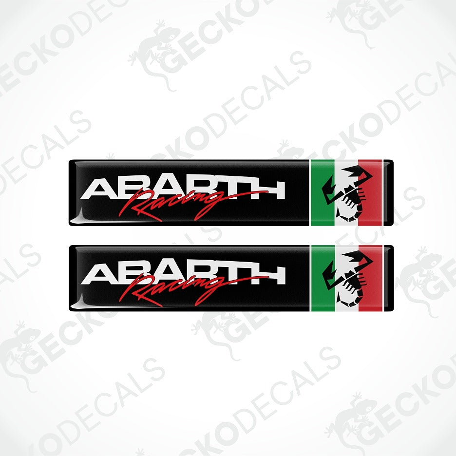 Two Abarth Racing decal stickers shown vertically on a light gray background with faint Geckodecals watermarks. Each decal has a black background with white 'ABARTH' text, red script 'Racing' text, and a vertical green and red flag stripe with a white horse head graphic.