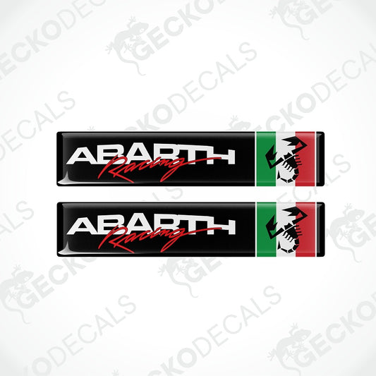Two Abarth Racing decal stickers shown vertically on a light gray background with faint Geckodecals watermarks. Each decal has a black background with white 'ABARTH' text, red script 'Racing' text, and a vertical green and red flag stripe with a white horse head graphic.