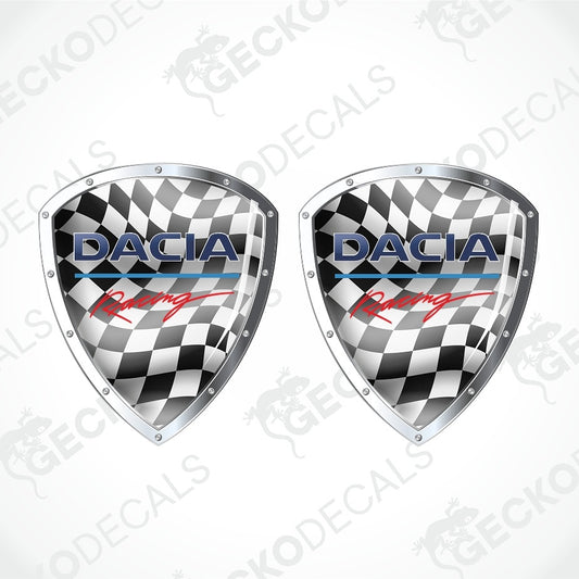 Two matching shield-shaped racing decals with a black-and-white checkered pattern, silver metallic borders, and the word 'DACIA' with a blue underline and red script, shown on a light gray background with repeated watermark text.
