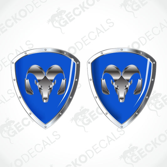 Two identical blue and silver shield-shaped decals with a ram head emblem, shown on a light gray background with a faint diagonal watermark pattern.