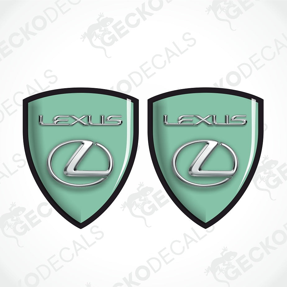 Two mint green Lexus shield-shaped decals with black borders and silver Lexus logos, shown on a white background with diagonal watermarks.