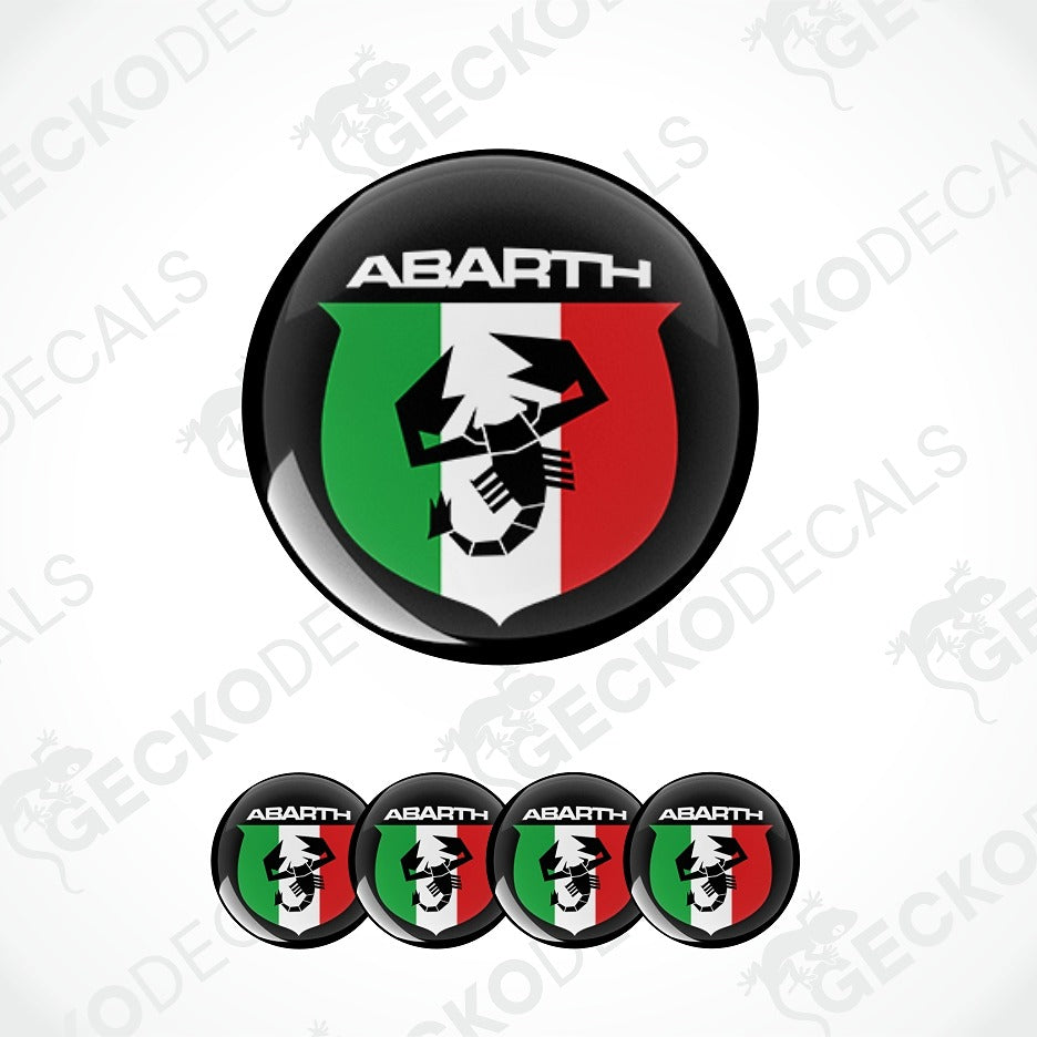 A set of circular Abarth decals featuring the Italian flag colors green, white, and red with a black scorpion logo and the word 'ABARTH' on a light gray background.