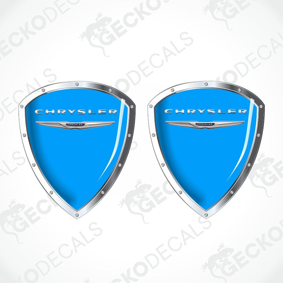 Two blue shield-shaped Chrysler decal stickers with silver borders and the Chrysler logo, shown on a white background with diagonal watermarks.