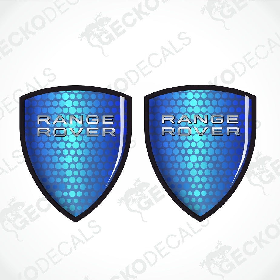 Two blue shield-shaped Range Rover decals with a metallic silver logo and a black border, displayed side-by-side on a white background with faint watermarks.