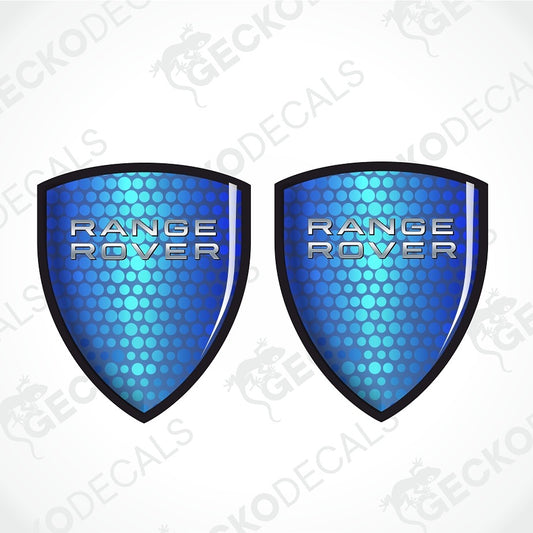 Two blue shield-shaped Range Rover decals with a metallic silver logo and a black border, displayed side-by-side on a white background with faint watermarks.