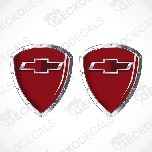 Two red shield-shaped decal emblems with silver metallic borders and Chevrolet bowtie logos, displayed on a white background with diagonal watermarks.