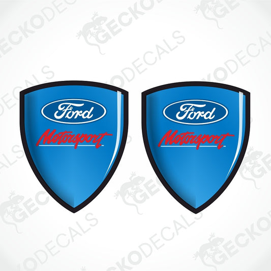 Two blue Ford Motorsport shield-shaped decals on a white background with a faint diagonal watermark pattern.