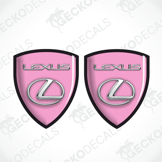 Two pink Lexus shield-shaped decals with black borders, silver Lexus lettering, and the Lexus logo, shown on a white background with diagonal watermarks.