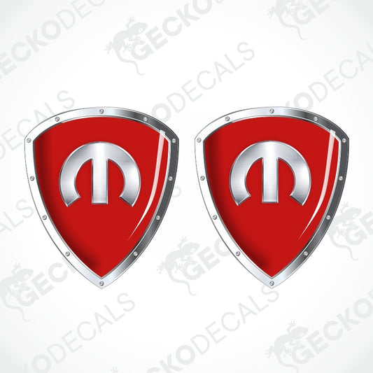 Two red shield-shaped decals with silver metallic borders and a silver emblem in the center, shown on a white background with a faint diagonal watermark pattern.