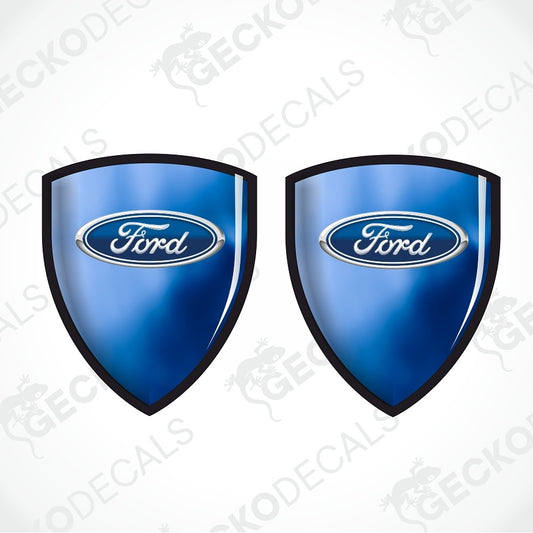 Two blue Ford shield-shaped decals with black borders and the Ford logo in the center, shown on a white background with a faint GECKODECALS watermark.
