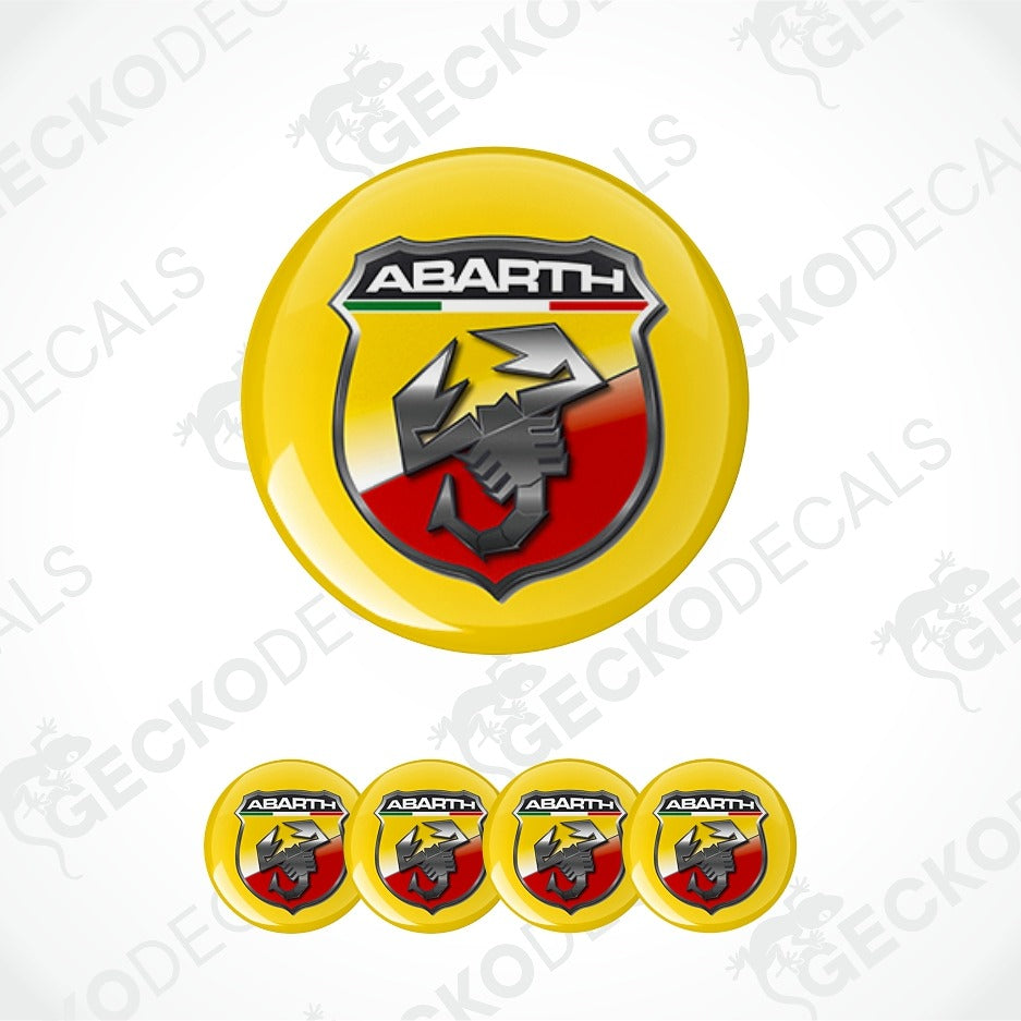 A set of circular yellow Abarth decal stickers, featuring the main Abarth logo in the center and four smaller identical decals aligned horizontally below on a white background with faint watermarks.