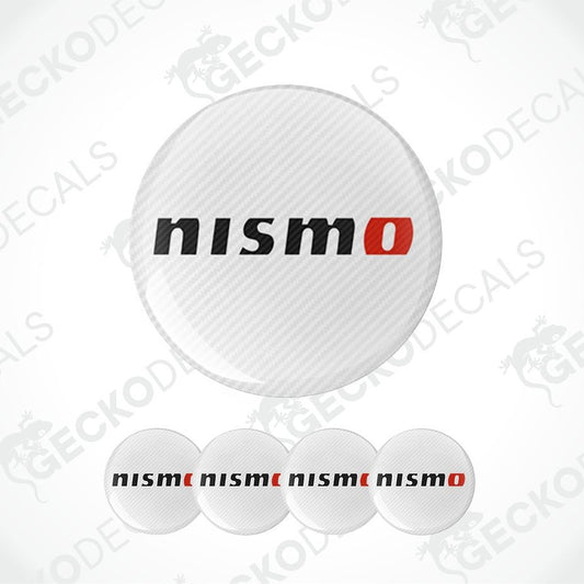A set of circular Nismo decal stickers, featuring a large carbon-fiber-textured sticker with the 'nismo' logo in black and red, and four smaller solid white stickers with the 'nismo' logo printed in black and red, shown against a light gray background with diagonal watermarks.