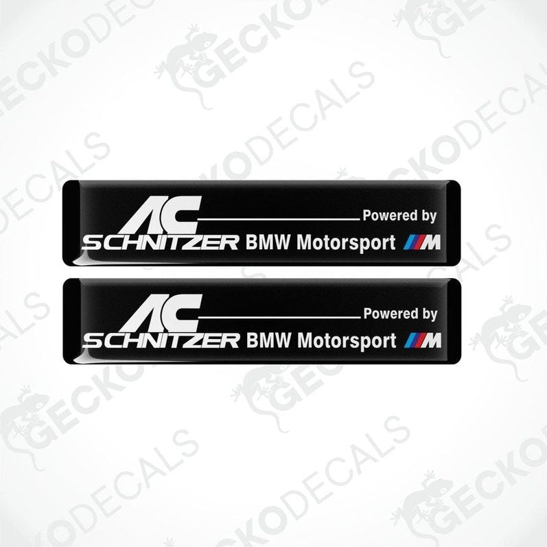 Two black vinyl decals with white text reading 'AC Schnitzer BMW Motorsport'.