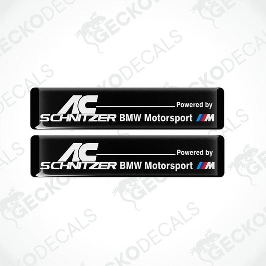 Two black vinyl decals with white text reading 'AC Schnitzer BMW Motorsport'.