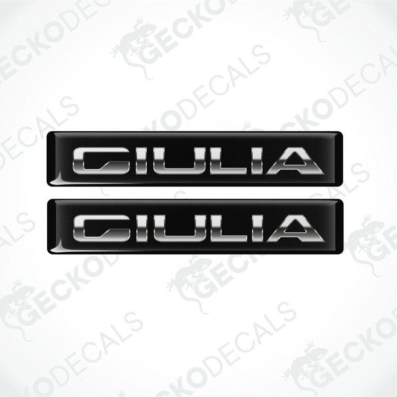 Two black and silver vinyl decals with the text 'GIULIA' on them, designed for use as car stickers.