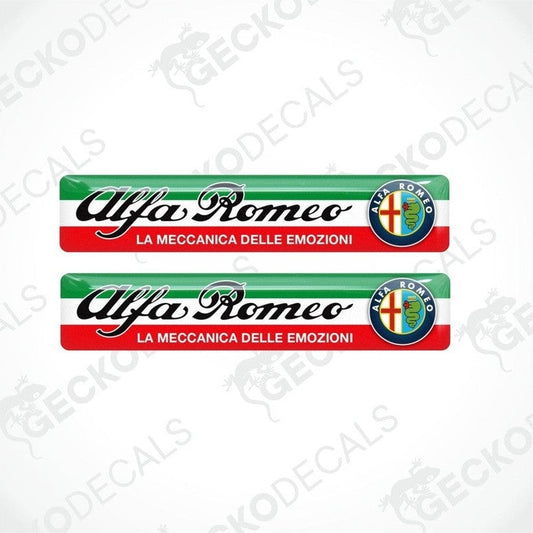 Two vinyl stickers with the Alfa Romeo brand and 'La Meccanica Delle Emozioni' text, featuring green, red, white, and blue colors.