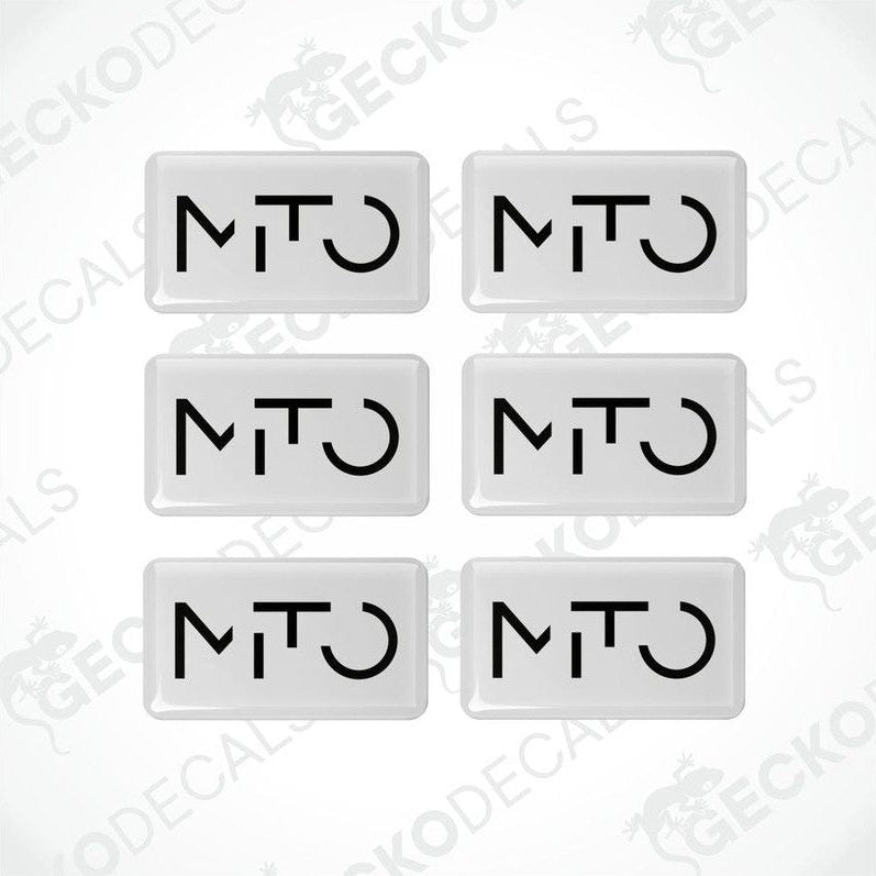 A set of six white vinyl decals with the 'MTO' logo in black.