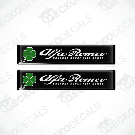 Two black vinyl stickers with green clover designs and the text 'ALFA ROMEO' in uppercase letters.