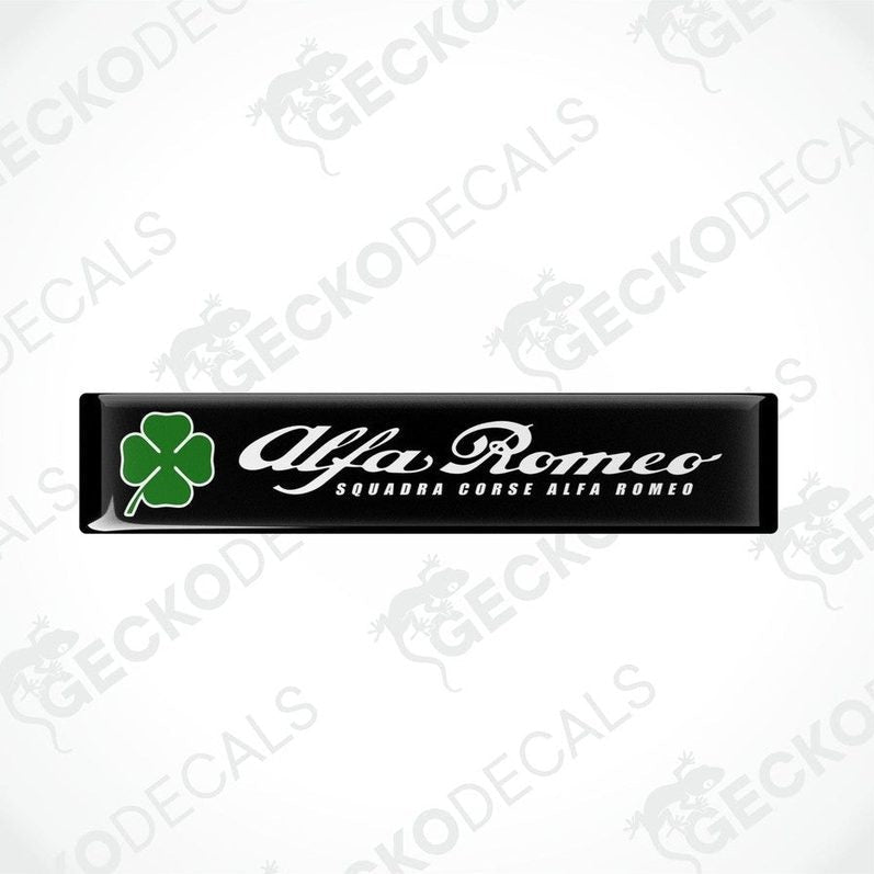Two black vinyl stickers with green clover designs and the text 'ALFA ROMEO' in uppercase letters.
