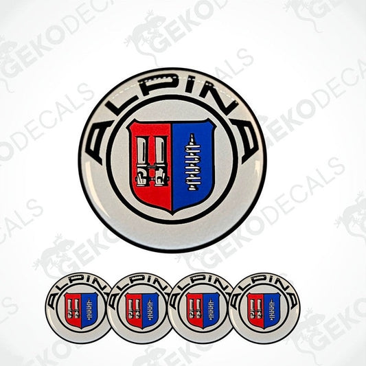 A set of four round vinyl stickers with a geometric design featuring the ALPINA brand logo in blue, red, and white colors.