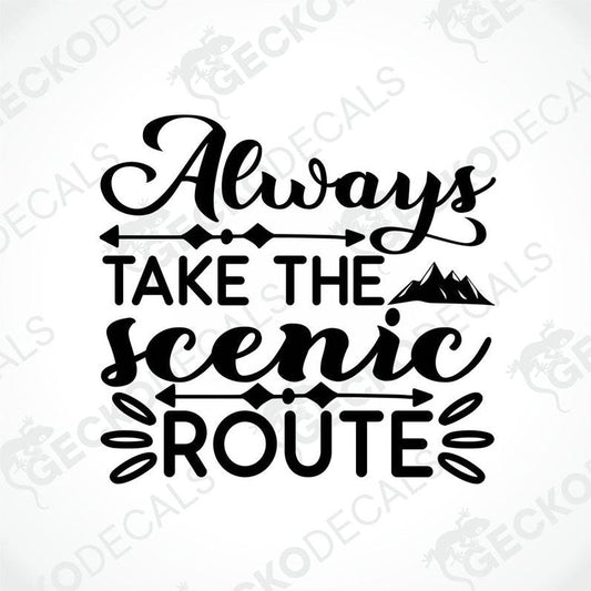 A black die cut sticker with the text 'ALWAYS TAKE THE SCENIC ROUTE' and a graphic of a mountain range.