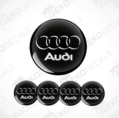 Set of vinyl decals with the Audi logo applied on a black background, intended for use as car stickers.
