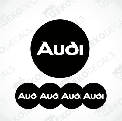 White Audi text in the center of the black circle